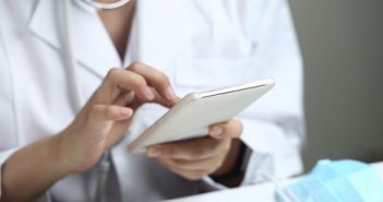 female doctor using cell phone