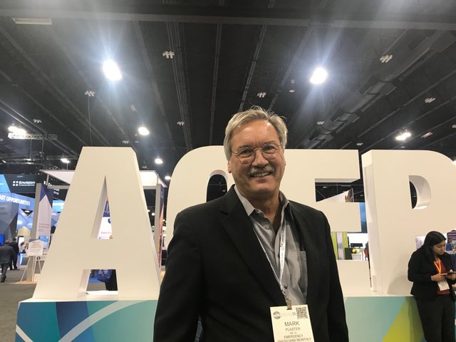 acep 2019 - mark plaster at the acep sign