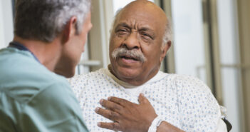 Doctor talking to patient in hospital