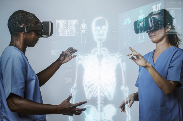 Doctors wearing VR simulation with hologram medical technology